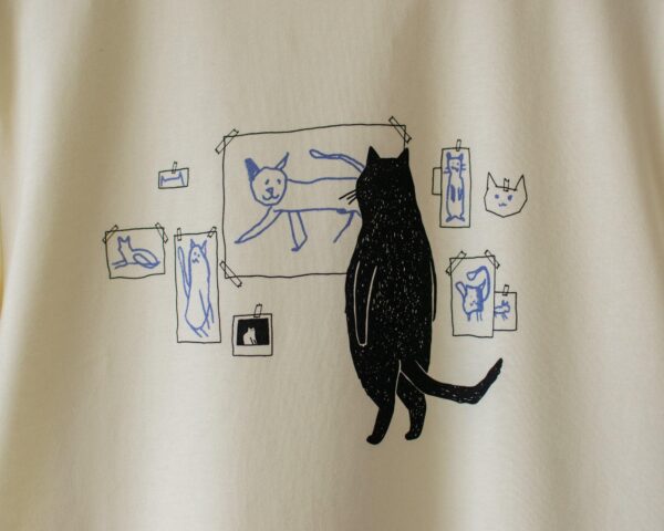 Cat gallery t-shirt | Hand screen printed on ecru/light yellow organic cotton tee with black and blue illustration of a cat judging cat art Top Womenswear Underwear Streetwear - Image 4