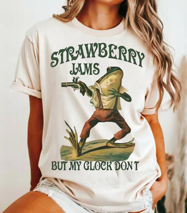 Strawberry Jams Glock T-Shirt , Strawberry Jams Glock Graphic T-Shirt , Glock-Wielding Frog T-Shirt , Strawberry Jams But My Glock Don't Tee , Unique Strawberry Jams Glock T-Shirt , Funny Glock T-Shirt , Quirky and Fun Design , Strawberry Jams Series - Image 2