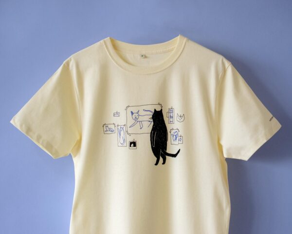Cat gallery t-shirt | Hand screen printed on ecru/light yellow organic cotton tee with black and blue illustration of a cat judging cat art Top Womenswear Underwear Streetwear